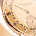 Closeup Photo of a Vacheron Constantin 18k Rosé Teardrop from the 1940s. 30mm 18k Rose Gold Case with Manual Wind Movement, Original Gold Dial and Leather Strap.
