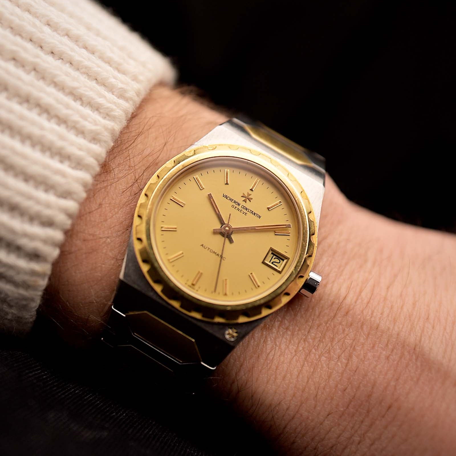 Vacheron Constantin 222 Ref 46003 Vintage watch from the 1980s, two-tone steel and 18k gold, golden Sigma dial, automatic movement on a wrist on black background