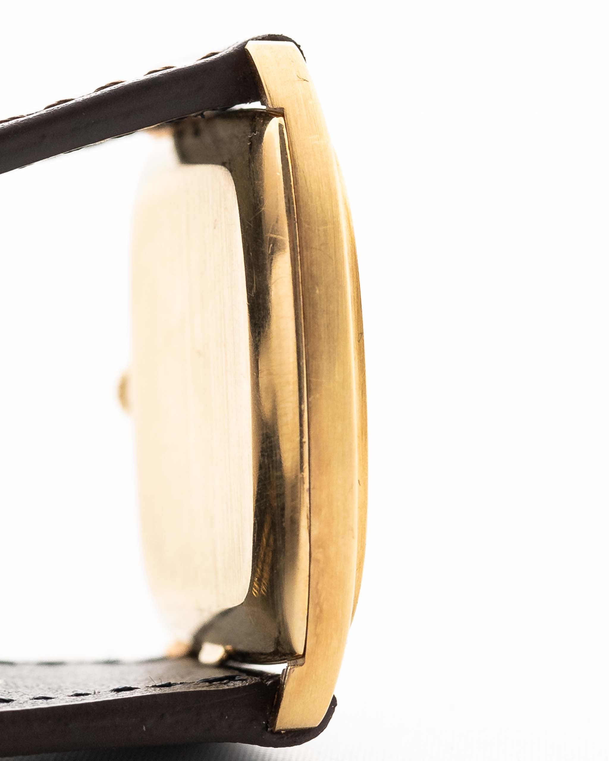 Closeup Photo of a Vacheron Constantin 39014 Tonneau 18k from the 1980s. 27mm 18k yellow gold case with Manual wind movement, Original Sigma dial and Leather strap.