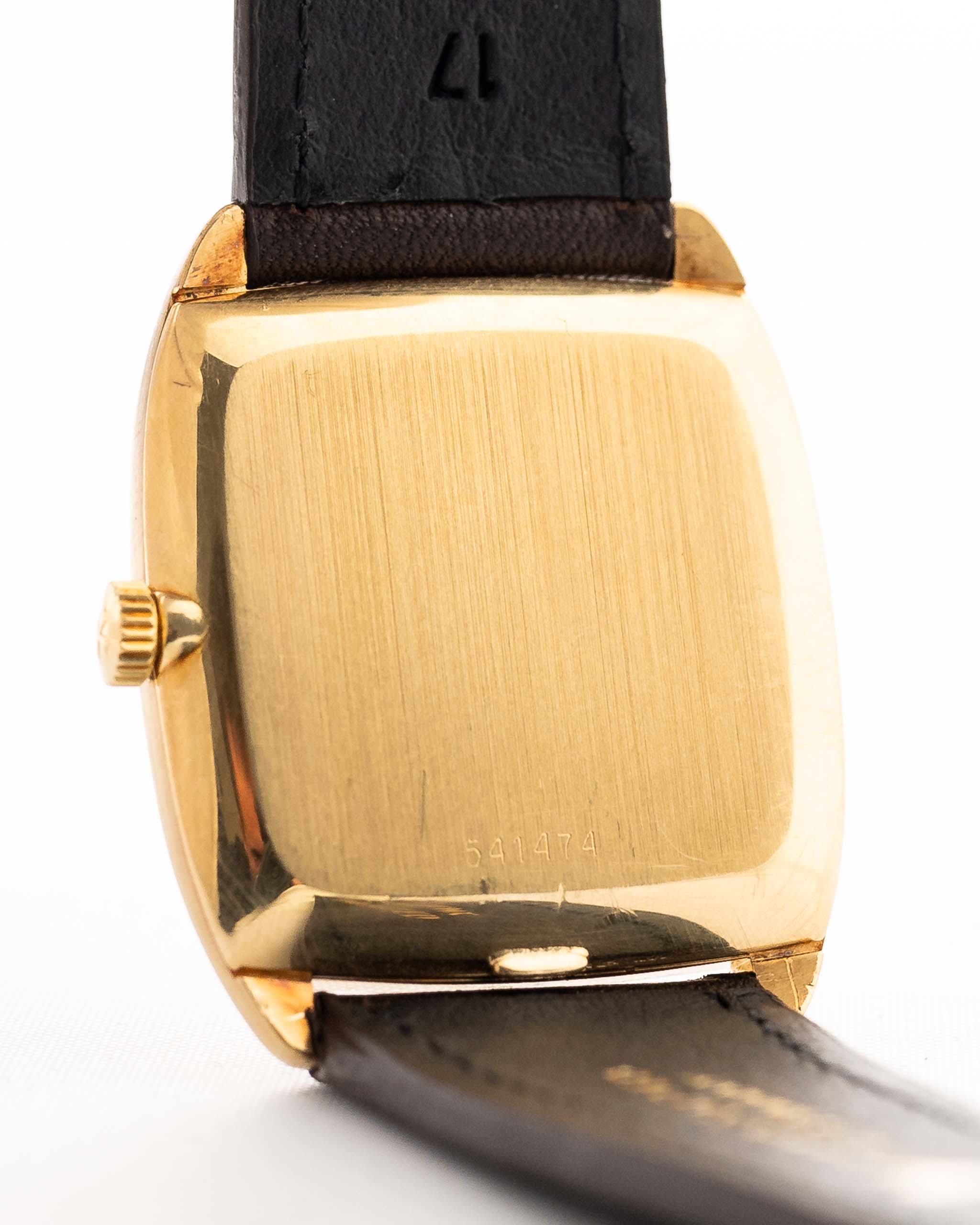 Closeup Photo of a Vacheron Constantin 39014 Tonneau 18k from the 1980s. 27mm 18k yellow gold case with Manual wind movement, Original Sigma dial and Leather strap.