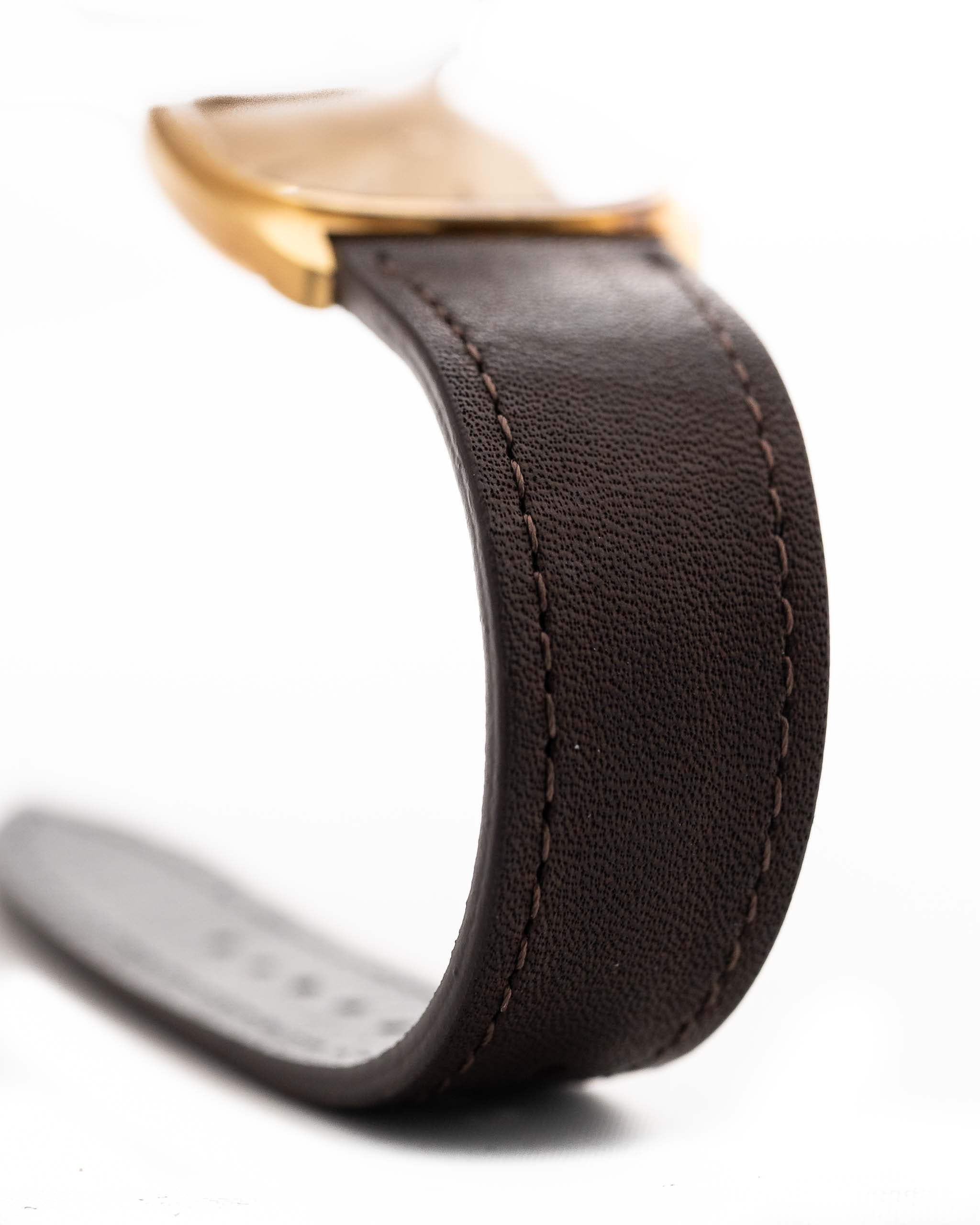 Closeup Photo of a Vacheron Constantin 39014 Tonneau 18k from the 1980s. 27mm 18k yellow gold case with Manual wind movement, Original Sigma dial and Leather strap.