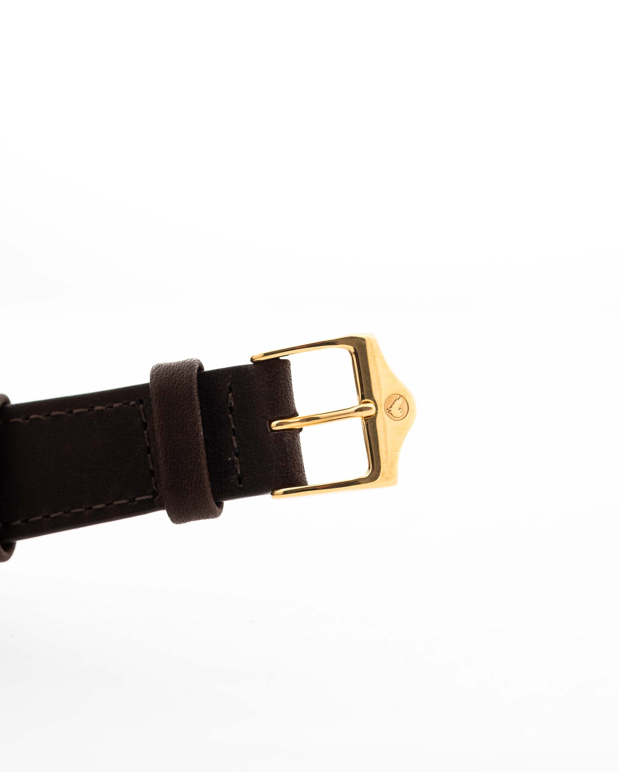 Closeup Photo of a Vacheron Constantin 39014 Tonneau 18k from the 1980s. 27mm 18k yellow gold case with Manual wind movement, Original Sigma dial and Leather strap.
