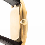 Closeup Photo of a Vacheron Constantin 39014 Tonneau 18k from the 1980s. 27mm 18k yellow gold case with Manual wind movement, Original Sigma dial and Leather strap.