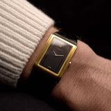 Photo of a Vacheron Constantin 71203 Harmony 18k from the 1980s on a wrist. 23mm with 18k Yellow Gold Case, Quartz Movement, Black Dial, Original Leather Strap and 18k Gold Buckle.