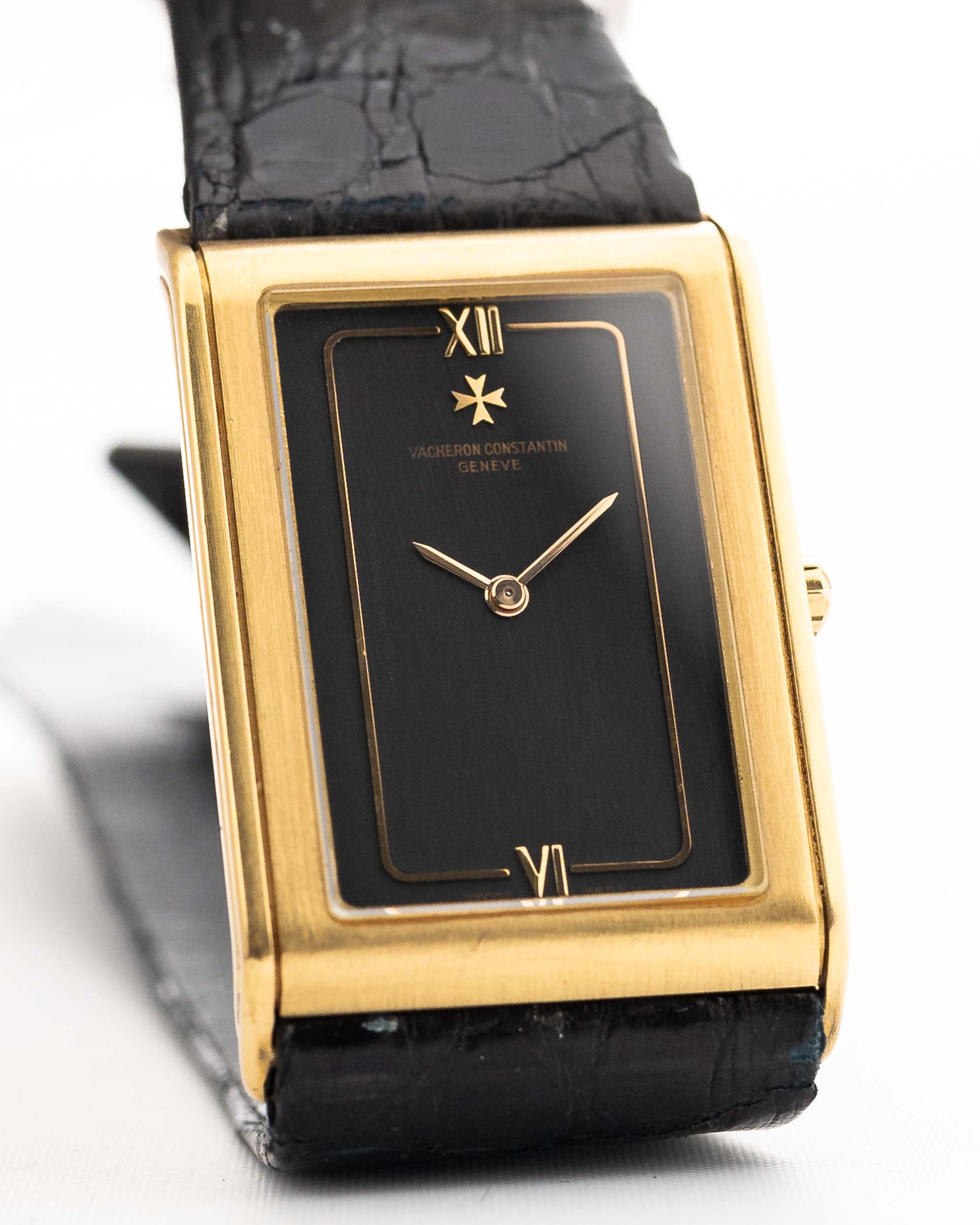 Closeup Photo of a Vacheron Constantin 71203 Harmony 18k from the 1980s. 23mm with 18k Yellow Gold Case, Quartz Movement, Black Dial, Original Leather Strap and 18k Gold Buckle.