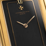 Closeup Photo of a Vacheron Constantin 71203 Harmony 18k from the 1980s. 23mm with 18k Yellow Gold Case, Quartz Movement, Black Dial, Original Leather Strap and 18k Gold Buckle.