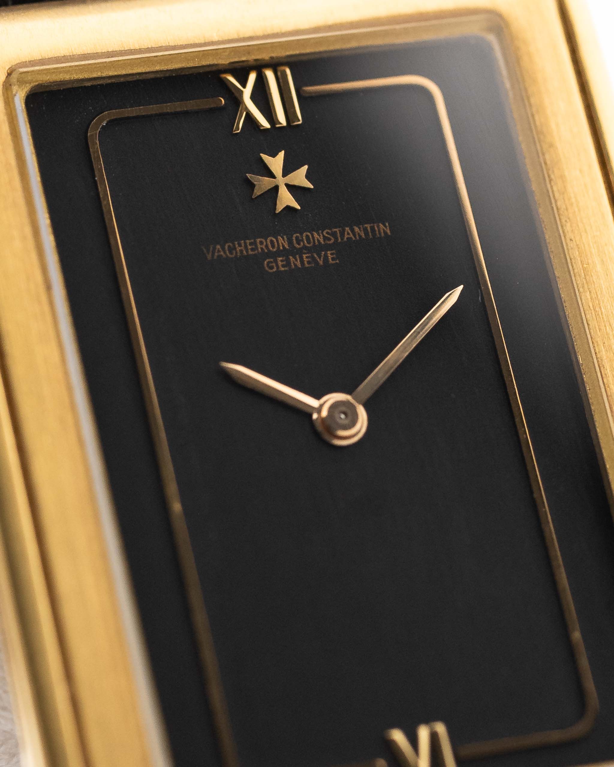 Closeup Photo of a Vacheron Constantin 71203 Harmony 18k from the 1980s. 23mm with 18k Yellow Gold Case, Quartz Movement, Black Dial, Original Leather Strap and 18k Gold Buckle.