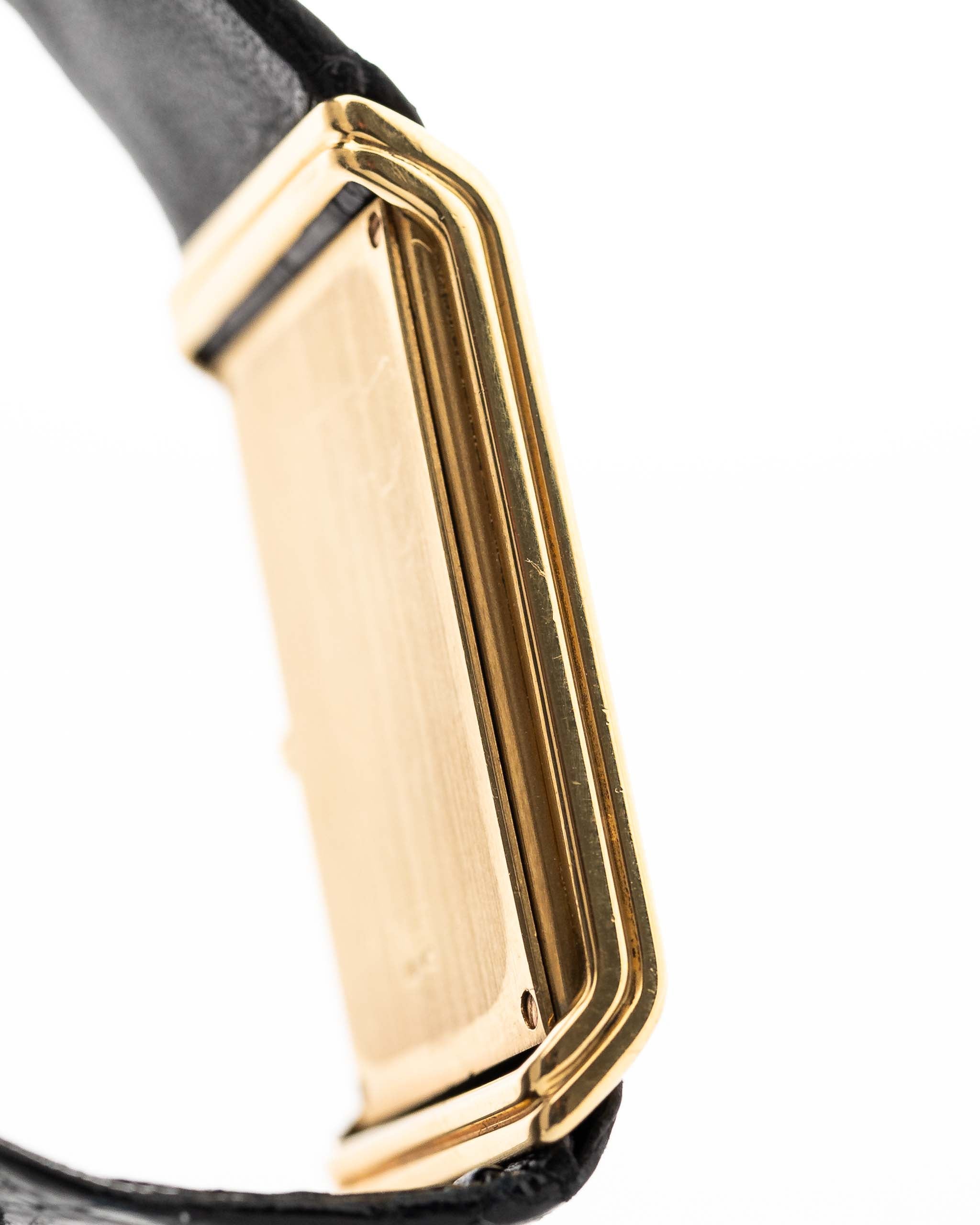 Closeup Photo of a Vacheron Constantin 71203 Harmony 18k from the 1980s. 23mm with 18k Yellow Gold Case, Quartz Movement, Black Dial, Original Leather Strap and 18k Gold Buckle.