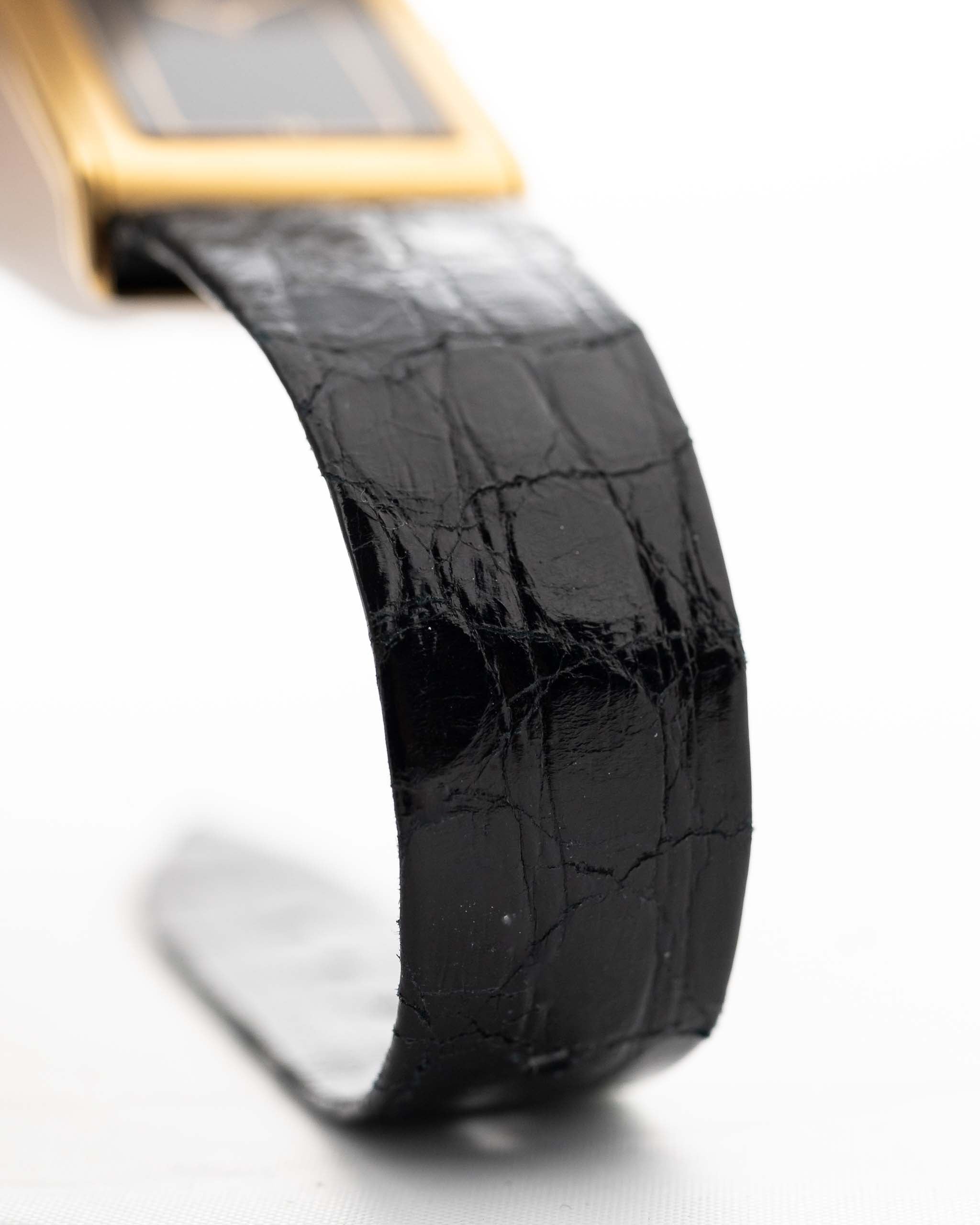 Closeup Photo of a Vacheron Constantin 71203 Harmony 18k from the 1980s. 23mm with 18k Yellow Gold Case, Quartz Movement, Black Dial, Original Leather Strap and 18k Gold Buckle.