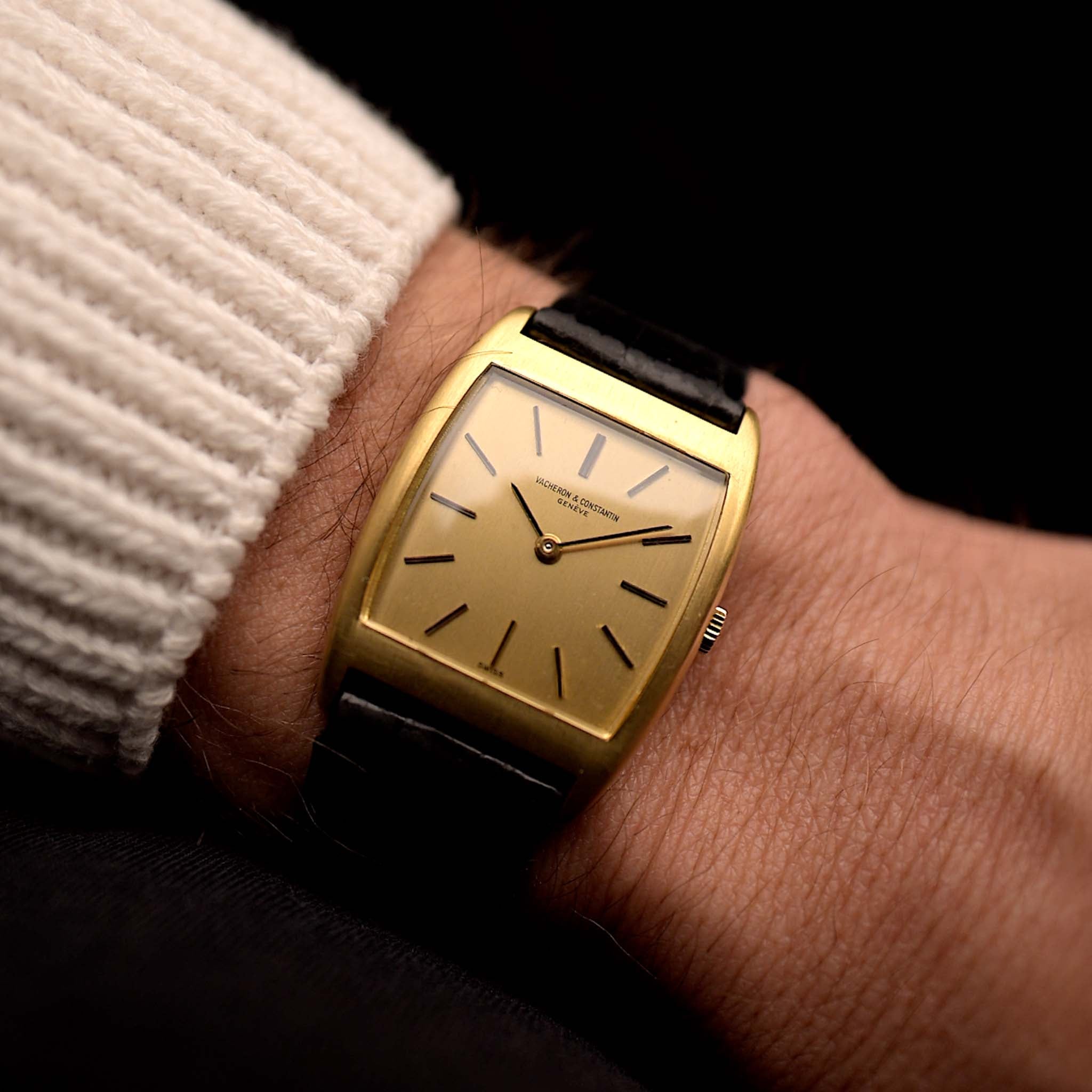 Photo of a Vacheron Constantin 7374 Tonneau from 1973 on a wrist. 28mm in 18k Yellow Gold with Manual wind movement, Brushed golden dial and Original Leather strap.