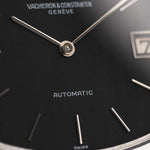 Close-up of a Vacheron Constantin watch face with 'Automatic' and 'Swiss' text.