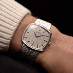 Video of a Piaget 12401 Automatic 18k TV Bark from the 1970s on a wrist. 32.5mm with 18k White Gold Case, Automatic Movement, White Gold Hammered Dial and Integrated 18k.