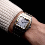 Video of a Vintage Cartier Santos Carrée 2961 Two Tone from 1990s on wrist. Two-tone stainless steel, Original white dial, Automatic movement and original bracelet.