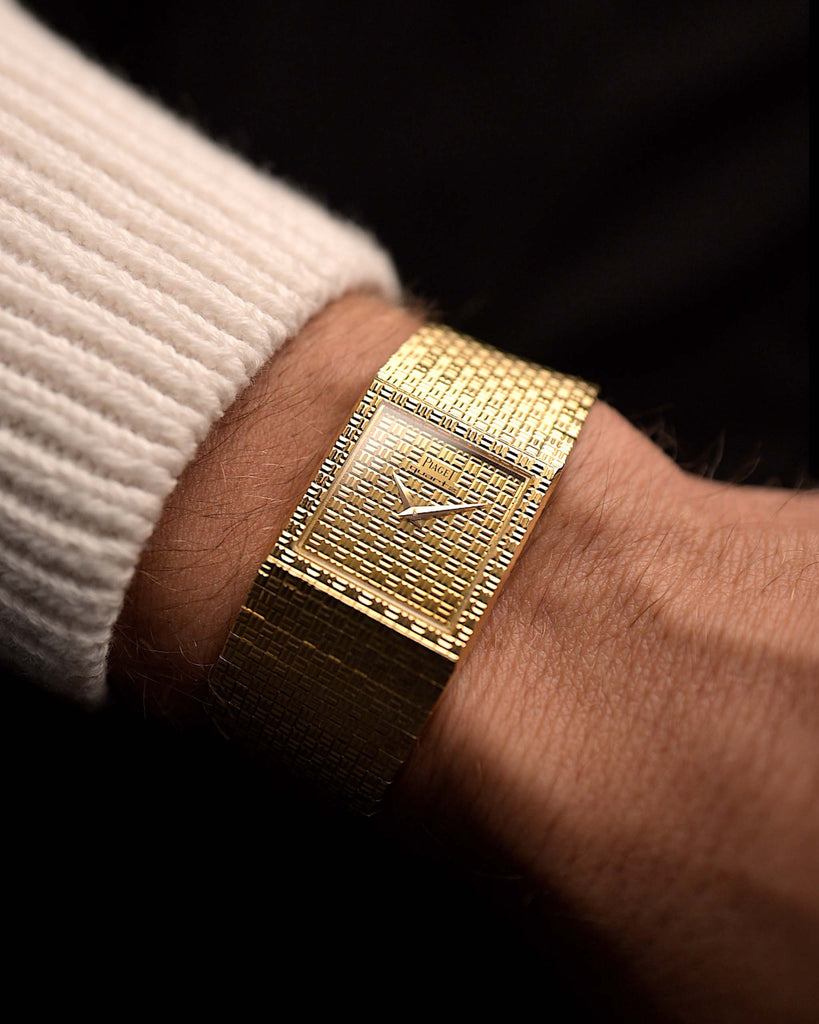 Vintage Piaget Polo 7131 C5 from 1980s on wrist. 23mm in 18k Yellow Gold with Guilloche Dial, Integrated 18k Gold Bracelet and Quartz Movement.