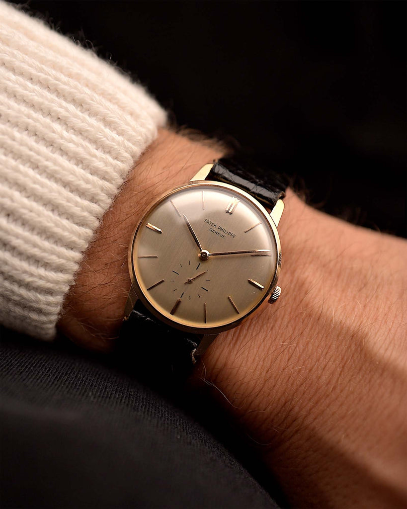 Vintage Patek Philippe 2598 Calatrava Watch 18k Rose from the 1950s on a wrist. 33mm with 18k Rose Gold Case, Manual Wind Movement, Flawless Silver Dial and Original Leather Strap.