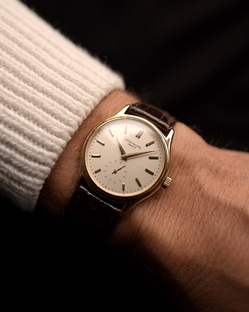 Vintage Patek Philippe 3923 Calatrava from the 1990s on a wrist. 32mm in 18k Yellow Gold with Manual Wind Movement, Sigma Dial, Original Leather Strap and 18k Gold Buckle.