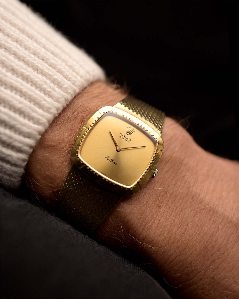 Vintage Rolex Cellini 4084 Watch Square 18k from 1978 on a wrist. 30mm with 18k yellow gold case, Manual wind movement, Golden dial and Original 18k yellow gold bracelet.
