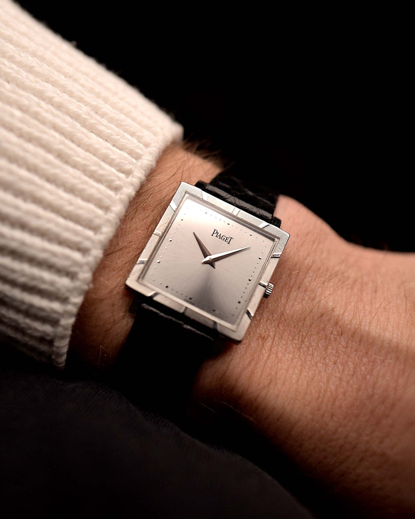 Video of a Piaget Protocole 927 18k White Gold from the 1970s on a wrist. 25mm in 18k White Gold with Manual wind movement, Silver sunburst dial and Original black leather strap.