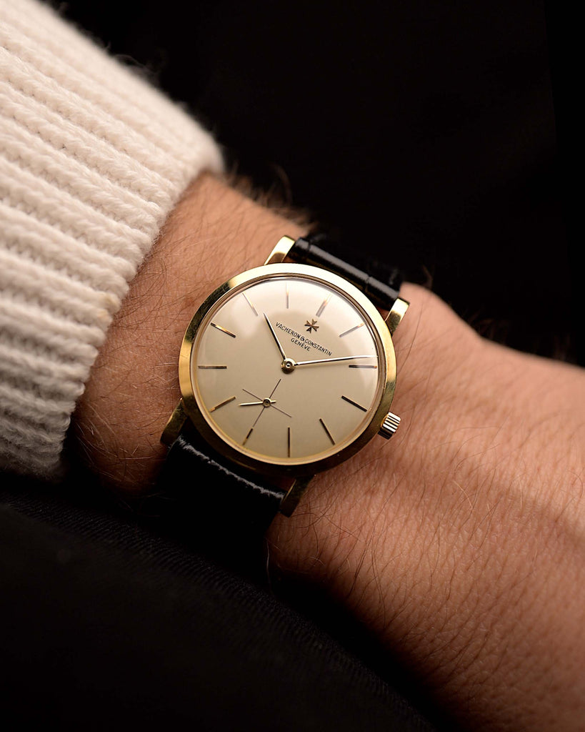 Vintage Vacheron Constantin 4667 Patrimony watch from 1956, 32mm 18k rose gold case, silver dial, manual wind movement, black leather strap on wrist, video