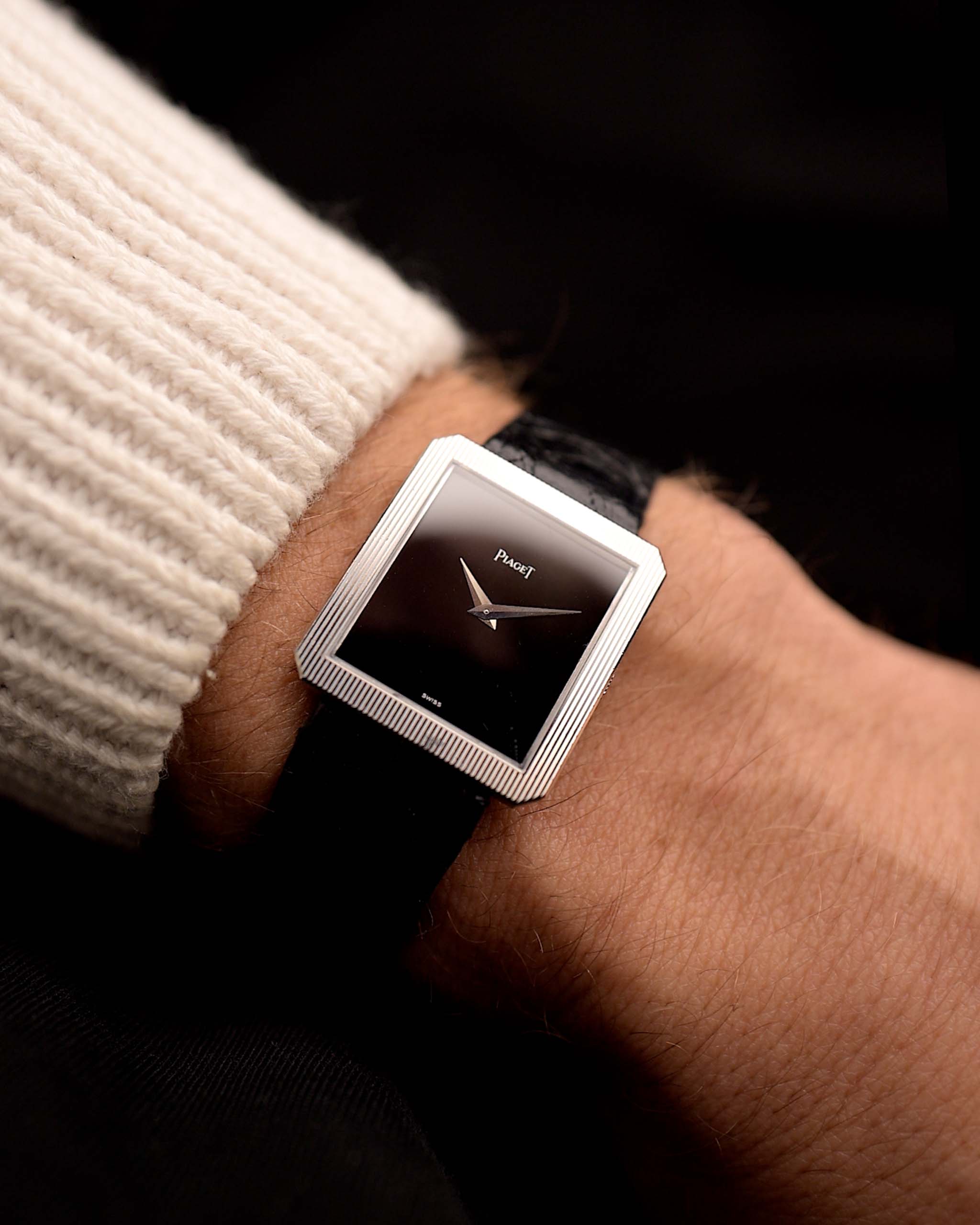 Vintage Piaget Protocole 9154 watch, in 18k white gold, onyx dial, tank case, 9P manual, leather strap on wrist, black background, video.