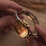 Vintage Patek Philippe Nautilus 3800 watch in two-tone gold and stainless steel, golden ribbed dial, automatic movement, on wrist, blurred background, video of details