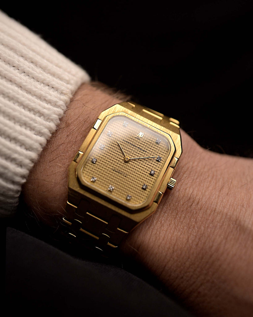 Audemars Piguet 6005BA Diamond from the 1980s on a wrist. 32mm in 18k Yellow Gold with Quartz movement, Hobnail dial, 11 diamond hour markers and Gold bracelet.