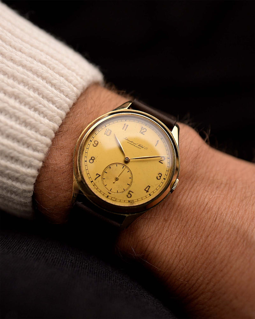 Vintage IWC Hermet Jumbo Watch Cal. 83 14k from 1938 on a wrist. 36.5mm with 14k Yellow Gold Case, Manual Wind Cal. 83, Original Golden Dial with Patina and Leather Strap.