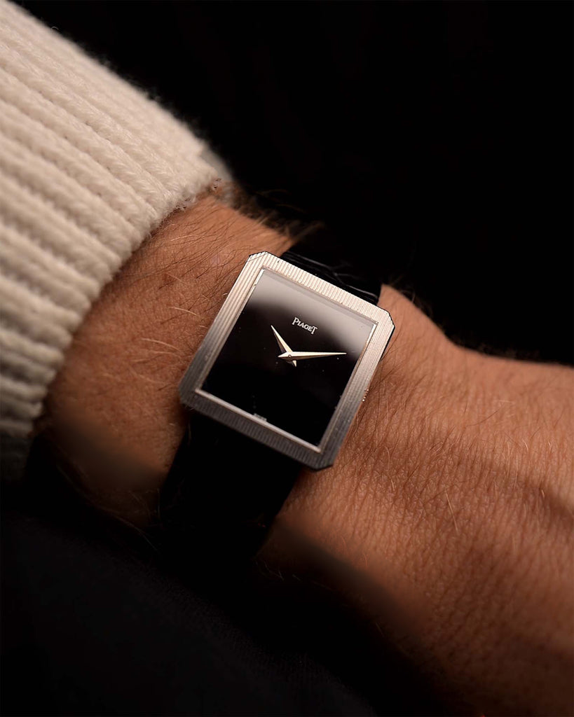 Vintage Piaget Protocole 9154 Onyx watch on a wrist from the 1970s. 25mm with 18k White Gold Case, Manual wind movement, Onyx Dial and Leather Strap.