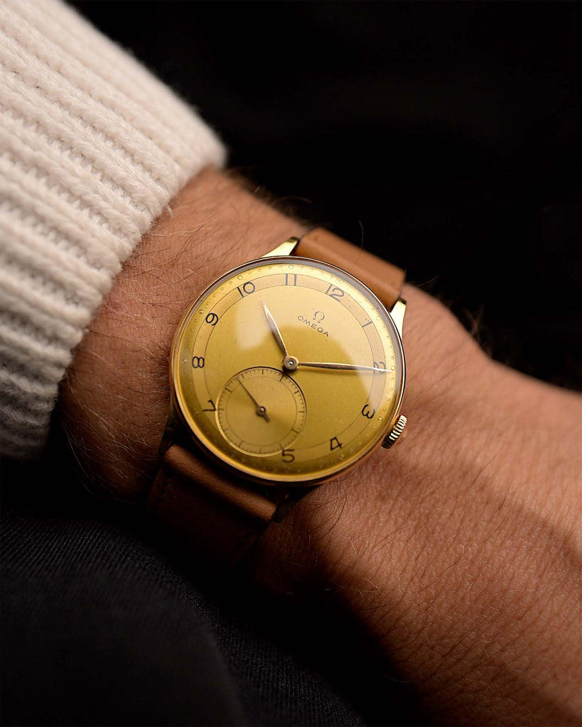 Vintage Omega 2317 Two Tone Sub Second from 1944 on a wrist. 35mm with Original two-tone dial, Gold-filled case, Manual wind Caliber 30T2 and Cognac leather strap.