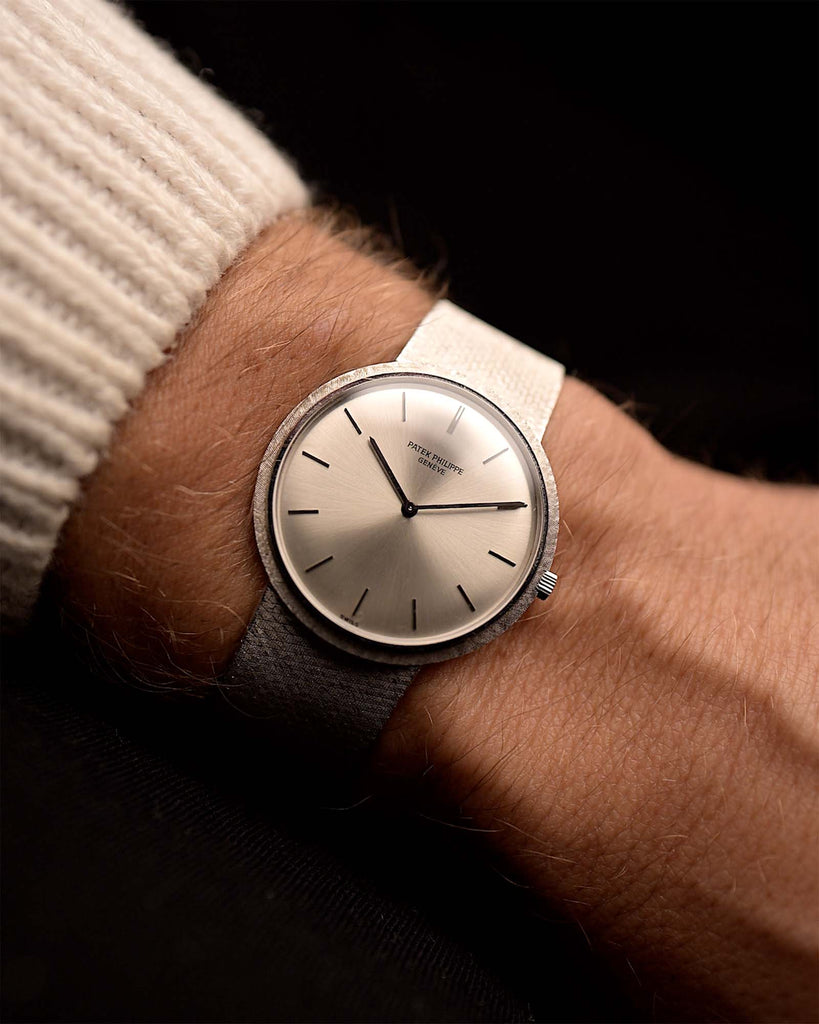 Vintage Patek Philippe 3520 Calatrava 18k from the 1970s on a wrist. 32mm with 18k White Gold Case, Original Silver Sunburst Dial, White Gold Bracelet and Manual Wind Movement.