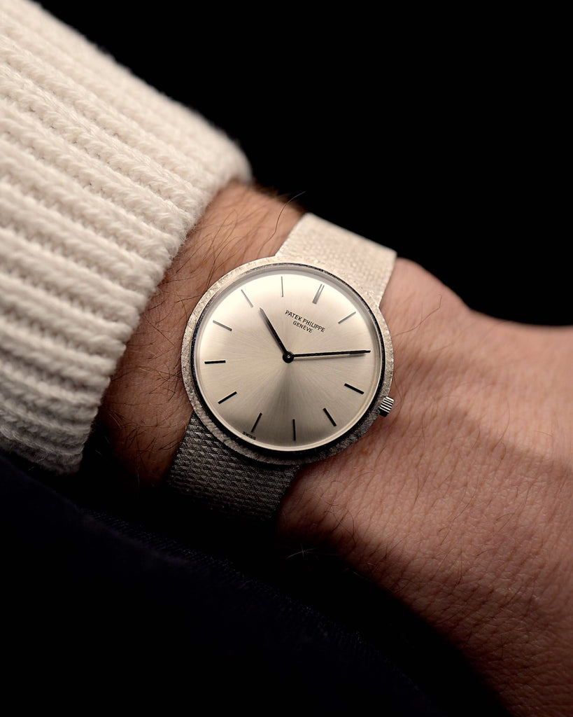 Vintage Patek Philippe 3520 Calatrava from the 1970s on a wrist. 32mm in 18k White Gold, Original Silver Sunburst Dial, White Gold Bracelet and Manual Wind Movement.