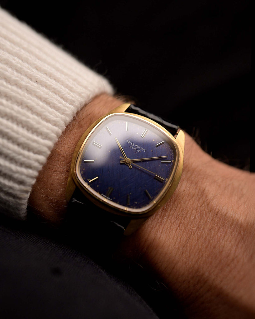 Vintage Patek Philippe Watch 3585 Jumbo Blue from the 1980s on a wrist. 36mm with 18k Yellow Gold Case, Automatic Caliber 350, Original Navy Blue Sigma Dial with Stardust Patina and Original Leather Strap.