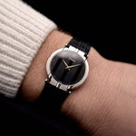 A video of a vintage Piaget Polo 7273 from the 1980s on a wrist. White gold case, 27.5mm, Piaget 7P Quartz movement with Original onyx dial and Leather strap.
