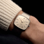 Vintage Rolex Cellini Watch 3805 Square 18k from 1970 on a wrist. 31.5mm in 18k White Gold with Manual wind movement, Flawless silver sunburst dial and White gold bracelet.