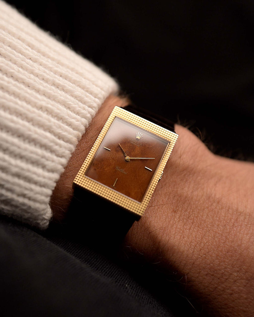 Vintage Rolex Cellini Watch 4127 Wood from 1990 on a wrist. 24mm with 18k yellow gold case, Flawless wood dial, Manual wind movement and Brown Rolex leather strap.
