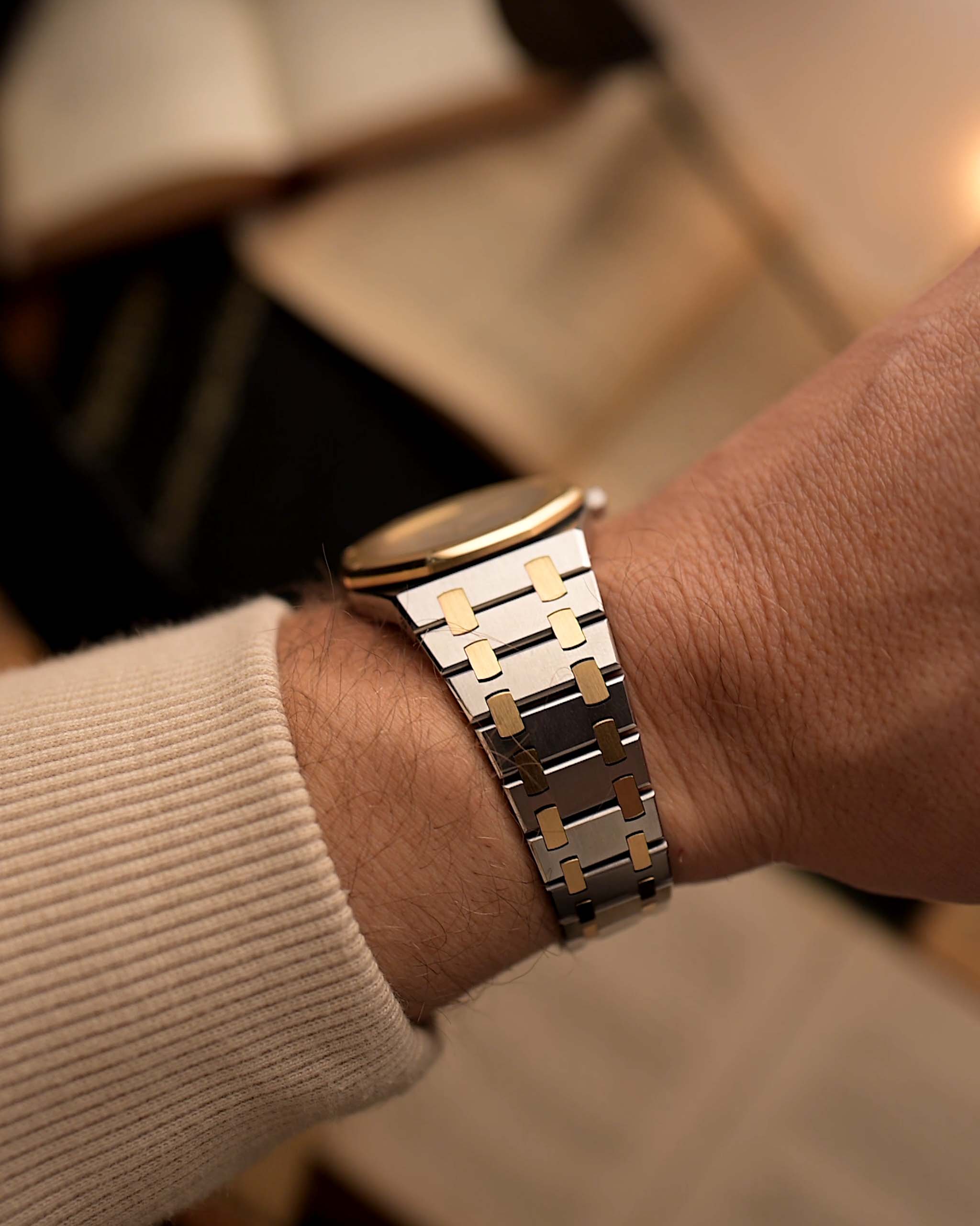 Audemars Piguet Royal Oak 14486SA Vintage Watch from the 1980s on a wrist on a blurred background.