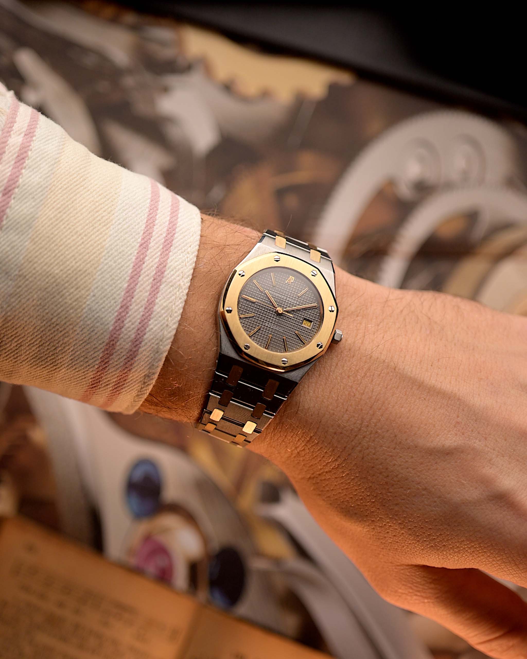 Audemars Piguet Royal Oak 14486SA Vintage Watch from the 1980s on a wrist on a blurred background.