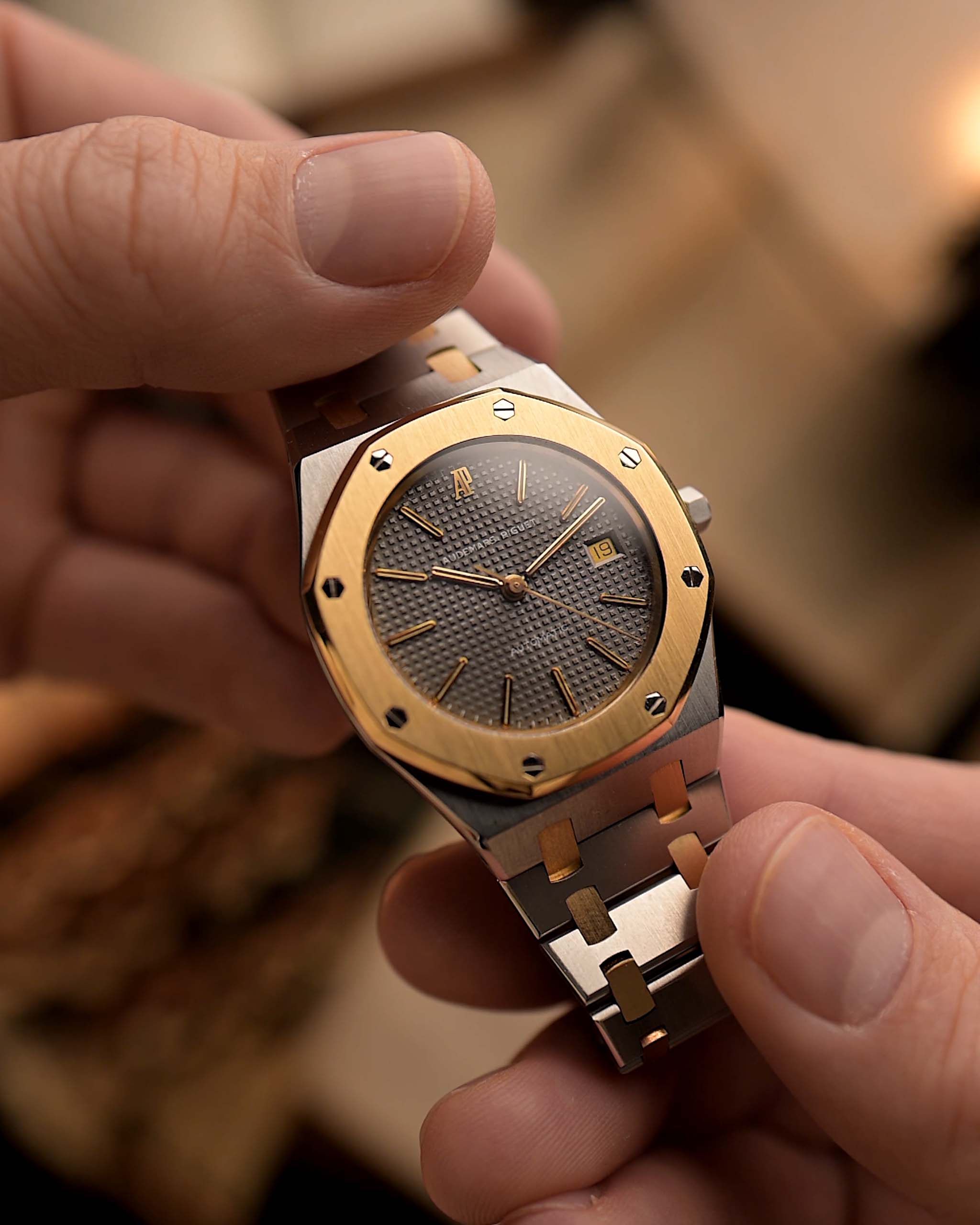 Audemars Piguet Royal Oak 14486SA Vintage Watch from the 1980s on a blurred background.