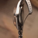 Reloj Rolex Datejust 1601 vintage, esfera plateada con efecto sol, caja de acero inoxidable, movimiento automático, brazalete Jubilee, fondo borroso, vídeo de detalles