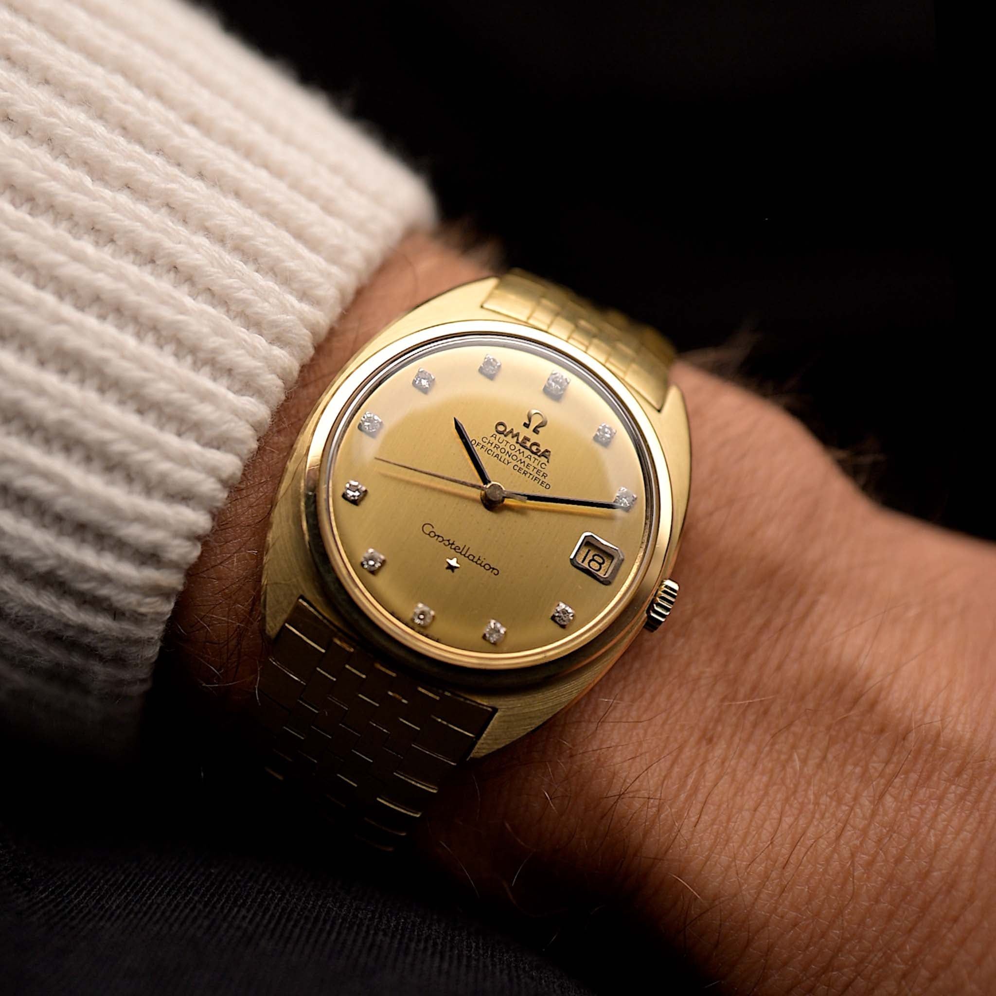 Omega Constellation 168009 Diamond，源自 1966 年。34mm 18K 黃金機芯，搭載 561 自動機芯，金色錶盤配鑽石刻度，18K 金錶鏈。