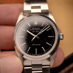 復古勞力士 Air King 14000 黑色腕錶，1999 年製造。34mm 不銹鋼材質，搭載 3130 自動機芯，完美無瑕的黑色錶盤和勞力士蠔式錶鏈。